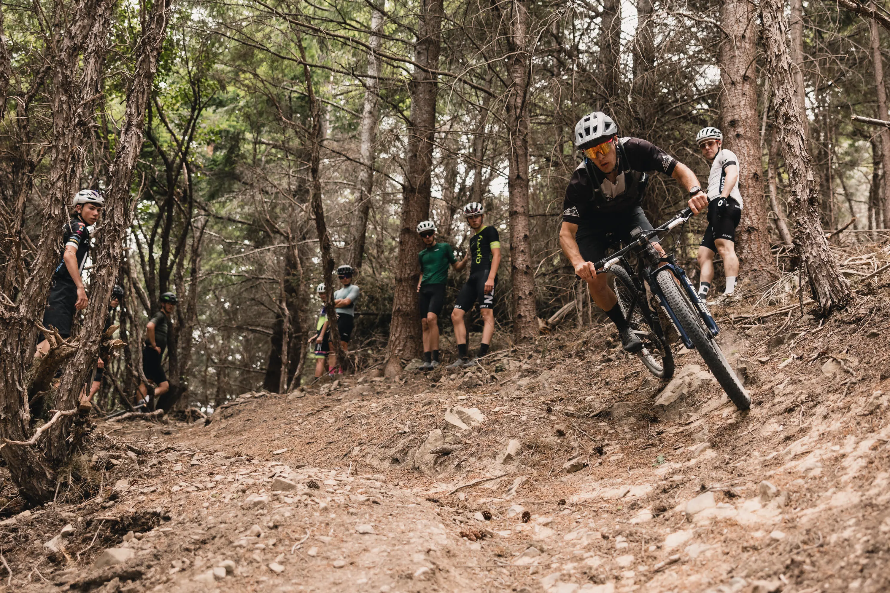 Group mountain bike skills session in the forest